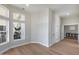 Bright, neutral living room with wood floors and large windows providing ample natural light at 21663 N 57Th Ave, Glendale, AZ 85308