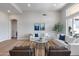 Bright living room features neutral decor, wood floors, and large windows for natural light at 21663 N 57Th Ave, Glendale, AZ 85308