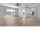 Bright living room with large windows offering waterfront views at 21663 N 57Th Ave, Glendale, AZ 85308