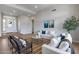 Cozy living room featuring two sofas, two chairs, and wood flooring throughout at 21663 N 57Th Ave, Glendale, AZ 85308