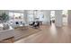 Spacious living room with modern furnishings and large windows showcasing water views at 21663 N 57Th Ave, Glendale, AZ 85308