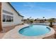 Backyard pool with views of the canal and beautiful houses in a scenic waterfront setting at 21663 N 57Th Ave, Glendale, AZ 85308