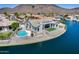 Waterfront home with pool, covered patio, and mountain views, perfect for outdoor enjoyment at 21663 N 57Th Ave, Glendale, AZ 85308
