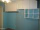 Bedroom with built-in cabinets and blue walls at 2324 W Via Rialto Cir, Mesa, AZ 85202