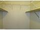 Walk-in closet space featuring upper shelving and room for storage at 2324 W Via Rialto Cir, Mesa, AZ 85202