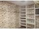 Walk-in closet with built in shelves at 2324 W Via Rialto Cir, Mesa, AZ 85202