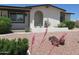 Charming single-story home with an arched entryway, desert landscaping, and well-maintained exterior at 2324 W Via Rialto Cir, Mesa, AZ 85202