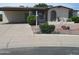 Charming single-story home with well-maintained landscaping and a cozy, inviting entrance at 2324 W Via Rialto Cir, Mesa, AZ 85202