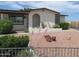 Inviting front yard with easy-care landscaping, showcasing curb appeal and charm at 2324 W Via Rialto Cir, Mesa, AZ 85202