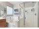 Bright bathroom featuring a soaking tub and glass enclosed shower at 23637 W Hopi St, Buckeye, AZ 85326