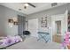 Bedroom showcasing neutral walls, ceiling fan, and a view into the home through an open doorway at 23637 W Hopi St, Buckeye, AZ 85326