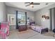 Bright bedroom with a large window, carpeted floors, and neutral walls, creating a cozy atmosphere at 23637 W Hopi St, Buckeye, AZ 85326