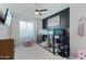 Fun bedroom featuring a bunk bed, ceiling fan, and a mounted TV at 23637 W Hopi St, Buckeye, AZ 85326