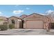 Inviting single-story home featuring a two-car garage and desert landscaping for low maintenance appeal at 23637 W Hopi St, Buckeye, AZ 85326