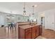 Open kitchen area featuring stainless steel appliances, an island with bar seating, and dining area at 23637 W Hopi St, Buckeye, AZ 85326