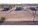 Large fenced property featuring multiple homes with an expansive lot, showcasing serene rural living at 23717 N Mustang Way, Florence, AZ 85132