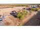 An elevated view showcasing the home's spacious lot, landscaping, and surrounding desert landscape at 23717 N Mustang Way, Florence, AZ 85132