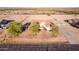 An elevated view of the house showing the expansive lot with horse property and desert landscape at 23717 N Mustang Way, Florence, AZ 85132