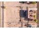 Detailed aerial view of a home showing a tile roof, solar panels, and expansive land at 23717 N Mustang Way, Florence, AZ 85132