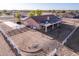 An aerial view showcasing solar panels, and a white fence creating a relaxing and private backyard at 23717 N Mustang Way, Florence, AZ 85132
