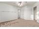 Bright bedroom with carpet, shelving, and closet offering ample storage at 23717 N Mustang Way, Florence, AZ 85132