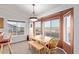 Bright dining area featuring large windows and views of the property's surroundings at 23717 N Mustang Way, Florence, AZ 85132