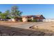 Spacious single-Gathering home with solar panels and a long driveway surrounded by desert landscaping at 23717 N Mustang Way, Florence, AZ 85132