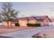 Home with large driveway, solar panels, and white perimeter fencing offering privacy and functionality at 23717 N Mustang Way, Florence, AZ 85132