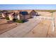 Aerial view of the home featuring solar panels and a long driveway at 23717 N Mustang Way, Florence, AZ 85132