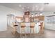 Kitchen bar area with barstool seating and views into the main kitchen at 23717 N Mustang Way, Florence, AZ 85132