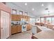 Kitchen with white appliances, ample counter space, and natural light from surrounding windows at 23717 N Mustang Way, Florence, AZ 85132