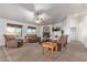 Spacious living room boasts a fireplace, large windows and comfortable leather seating at 23717 N Mustang Way, Florence, AZ 85132