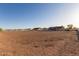 An exterior shot of the lot highlighting the property's potential for expansion and outdoor activities at 23717 N Mustang Way, Florence, AZ 85132