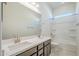 Bright bathroom with a double sink vanity, large mirror, and combination tub and shower at 242 S 165Th Ave, Goodyear, AZ 85338