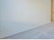 Clean bedroom featuring plush carpeting and access to other rooms in the home at 242 S 165Th Ave, Goodyear, AZ 85338