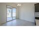 Dining area with sliding glass doors leading to a covered patio, and chandelier lighting at 242 S 165Th Ave, Goodyear, AZ 85338