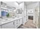 Bright bathroom featuring double sinks, modern mirrors, and walk-in shower at 2462 W Turtle Hill Dr, Anthem, AZ 85086