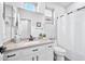 Well-lit bathroom with granite countertop, modern fixtures, and classic white cabinetry at 2462 W Turtle Hill Dr, Anthem, AZ 85086