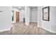 Welcoming foyer showcasing wood-look flooring, natural light, and a stylish entryway with a decorative rug at 2462 W Turtle Hill Dr, Anthem, AZ 85086