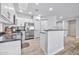 Bright kitchen with white cabinets, stainless steel appliances, and gray countertops, offering a modern design at 2462 W Turtle Hill Dr, Anthem, AZ 85086