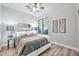 Stylish bedroom with hardwood floors, comfortable bedding, and natural light at 2462 W Turtle Hill Dr, Anthem, AZ 85086