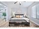 Comfortable bedroom featuring neutral decor, wood-look flooring, and a ceiling fan at 2462 W Turtle Hill Dr, Anthem, AZ 85086