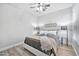 Stylish bedroom with hardwood floors, comfortable bedding, and natural light at 2462 W Turtle Hill Dr, Anthem, AZ 85086