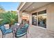 Charming covered patio with stylish seating, ideal for enjoying outdoor meals and relaxing moments at 2462 W Turtle Hill Dr, Anthem, AZ 85086