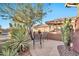 Inviting flagstone patio with seating and desert landscaping at 2462 W Turtle Hill Dr, Anthem, AZ 85086