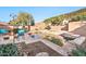 Inviting backyard featuring a pool, spa, and a cozy fire pit area, perfect for outdoor gatherings at 2462 W Turtle Hill Dr, Anthem, AZ 85086