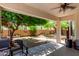 View of the backyard and covered patio, perfect for relaxing or entertaining outdoors at 2489 E Sequoia Dr, Chandler, AZ 85286