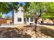 View of the backyard and back of home featuring a covered patio and ample yard space at 2489 E Sequoia Dr, Chandler, AZ 85286