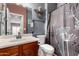 Bathroom featuring a sleek vanity, decorative mirror, and modern shower at 2489 E Sequoia Dr, Chandler, AZ 85286