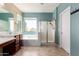 Bright bathroom featuring a soaking tub, glass-enclosed shower, and double vanity at 2489 E Sequoia Dr, Chandler, AZ 85286